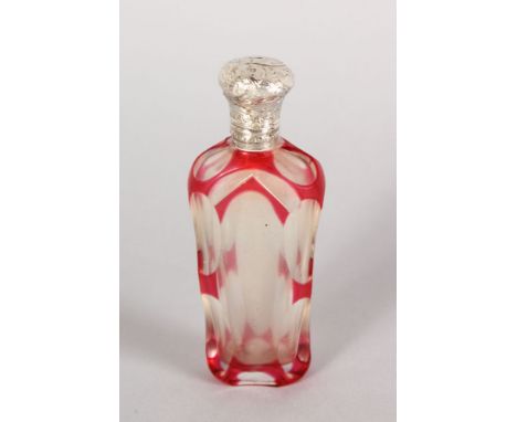 A VICTORIAN RUBY TINTED SCENT BOTTLE with silver top. 3.5ins long.