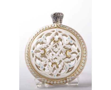 A GRAINGER & CO WORCESTER CIRCULAR RETICULATED PORCELAIN PERFUME BOTTLE, 8cms diameter, Circa. 1880, silver screw top. Proven