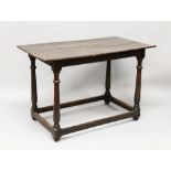 A 17TH CENTURY OAK PLANK TOP TABLE, with figured top, on turned support with uniting stretchers. 3ft