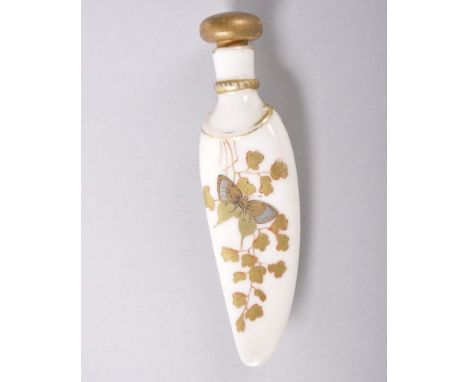 A ROYAL WORCESTER PORCELAIN SCENT BOTTLE shaped like a tigers tooth, decorated with flowers and a butterfly in gilt, date sym