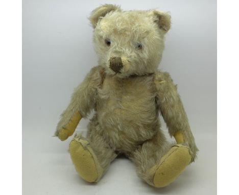 A 1960 Steiff Teddy bear, lacking button, 34cm