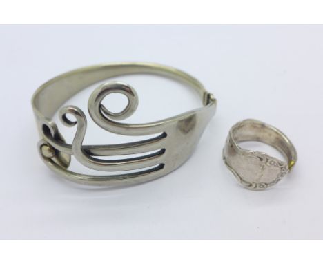 A novelty bangle made from a fork and a similar ring, R