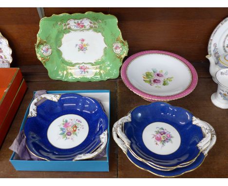 Four Coalport plates, two signed D. Cafrey, a Copeland Spode Rutland dish and a pink rimmed comport with chips to the rim