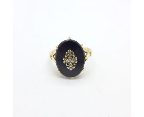 A 9ct gold and onyx ring, 3.8g, K