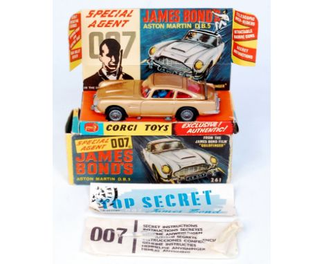 Corgi Toys, 261 James Bond's Aston martin DB5, gold body, red interior with wire wheels, 1 bandit figure, mechanisms in worki