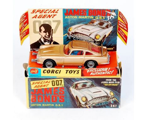 Corgi Toys, 261 James Bond's Aston martin DB5, gold body, red interior with wire wheels, 1 bandit figure, mechanisms in worki