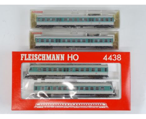 A FLEISCHMANN HO Gauge 4438 2-car diesel railcar together with two additional 4439 centre cars - vendor advises DCC fitted - 