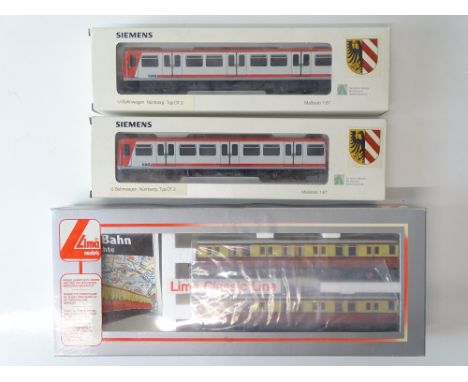 A group of HO Gauge light rail units comprising a LIMA Berlin S-Bahn 2-car railcar and a non powered SIEMENS U-Bahn 2-car Nur