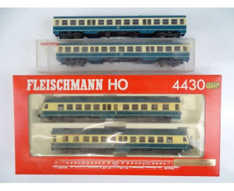 A FLEISCHMANN HO Gauge 4430 2-car diesel railcar together with two unboxed centre railcars - vendor advises DCC fitted - G in