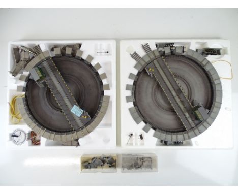 A pair of HO Gauge FLEISCHMANN electric turntables to include additional boxes containing track exits - F/G in F/G boxes (4)