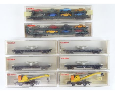 A mixed group of HO Gauge German Outline wagons comprising crane wagons, flat cars and car transporters by FLEISCHMANN - G/VG