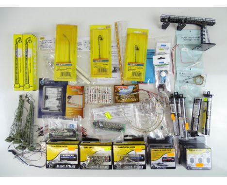 A mixed group of HO Gauge electrical accessories including building lighting kits, yard lights etc. - G/VG - most in original