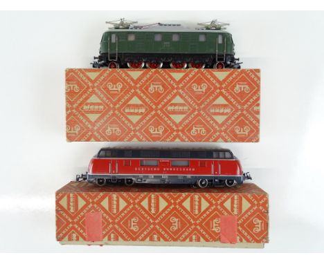A pair of vintage 3-rail MARKLIN HO Gauge diesel and electric locomotives comprising a 3021 V200 diesel loco and a 3024 E18 C