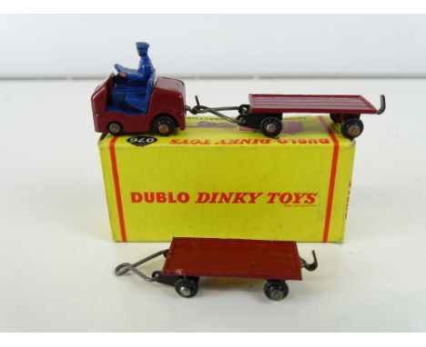 A DUBLO DINKY 076 Lansing Bagnall tractor and trailer in original box together with an additional trailer - G/VG in G/VG box