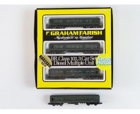 A GRAHAM FARISH N Gauge Class 101 3-car DMU in BR green together with an additional unboxed centre car - G/VG in G box (where