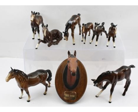 A SELECTION OF SEVEN BESWICK MODEL HORSES, in brown glaze, comprising one horse and seven foals, together with "RED RUM" feat