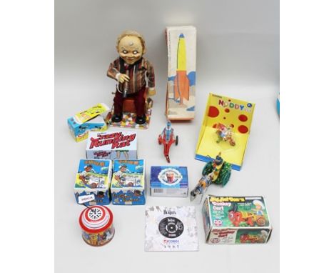 A 1950'S JAPANESE TIN-PLATE BATTERY TOY of an Old Man sitting on a tin trunk with cigar in hand (for repair), together with P