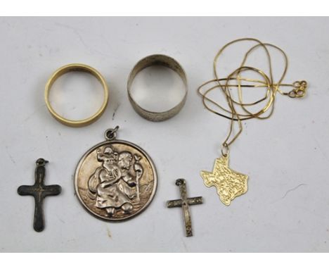 A 9CT GOLD WEDDING BAND, a 14k gold PENDANT ON CHAIN, a silver ST. CHRISTOPHER, TWO SILVER CROSSES and a silver RING 