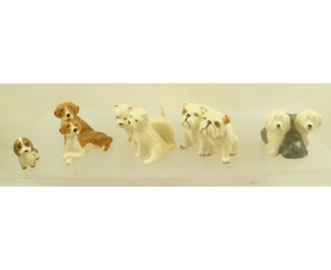 FOUR BESWICK CERAMIC DUO MODELS, comprising Bulldogs, Westies, Beagles, and Old English Sheepdog, together with a SZEILER PUP