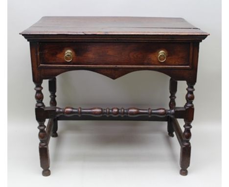 AN 18TH CENTURY OAK SIDE TABLE (with later alterations), having rectangular plank top, over single full width drawer, with pl