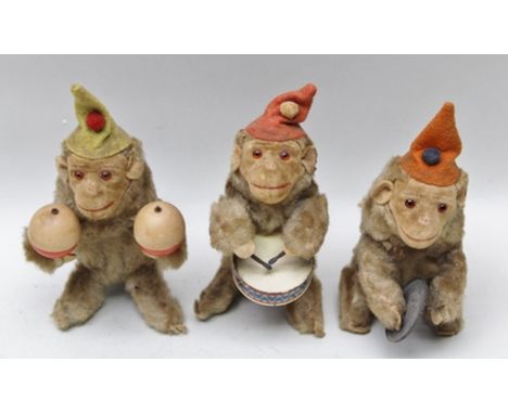 THREE PLUSH COVERED CLOCKWORK MONKEY BAND PLAYERS playing cymbals, drum and maracas 