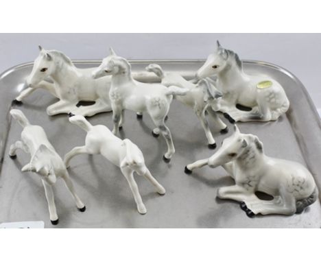 A SELECTION OF BESWICK CERAMIC DAPPLE GREY HORSES AND FOALS, to include two by Royal Doulton and including one white blanc de