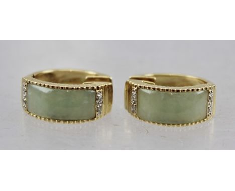 A PAIR OF HEAVY 14K GOLD JADE & DIAMOND EARRINGS of circular form 