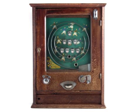 Football penny slot pinball machine , with eight cups, with one key, 75cm high At the time of cataloguing this machine works 