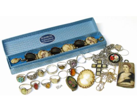 An assortment of costume jewellery to include 15 silver dress rings, a silver and mother of pearl crucific on silver chain, s