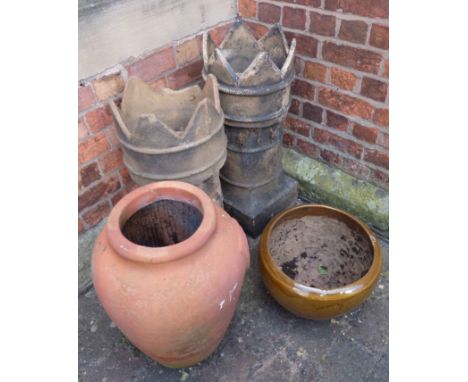 Two chimney pots, terracotta urn and glazed planter