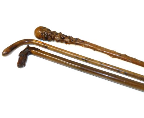 Late 19th century Russian hardwood walking cane, the handle in the form of a horses head and a cossack, both with glass eyes 