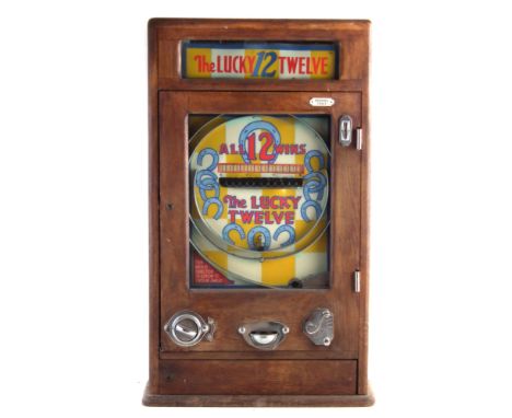 Oliver Whales Lucky Twelve penny slot pinball machine, with key to case safe only, 81cm high, The machine needs some work as 