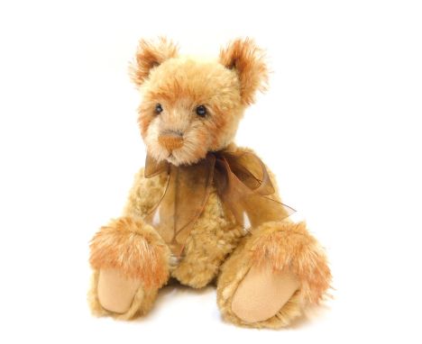 A Charlie Bears plush jointed Teddy bear, with two tone light brown colouring, bearing label, 34cm high. 