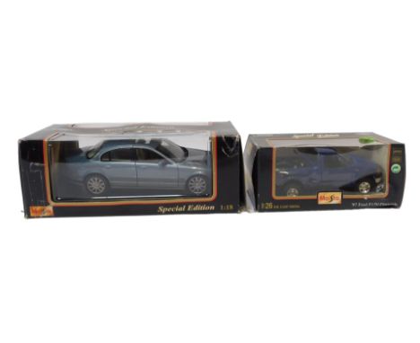 Maisto 1:18 and 1:26 scale diecast vehicles, comprising 97 Ford F150 flare side, and a Jaguar S type 1999, boxed. (2)