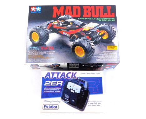 A remote control vehicle, comprising Tamiya Mad Bull 1-10 scale high performance off road racer, kit build, and an Attack 2ER