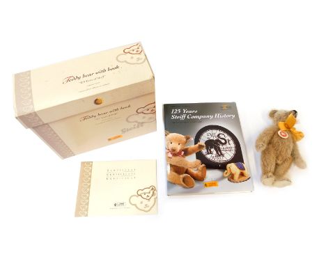 A Steiff Teddy bear with book, Celebrating 125 Years of the Steiff Company History, in presentation box with tags. 