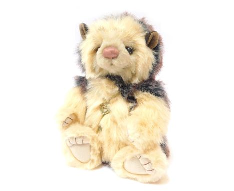 A Charlie Bears Teddy bear, dark and light brown with key pendant, bearing label, CB165104, 26cm high. 