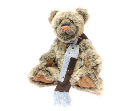 A Charlie Bears grey two toned Teddy bear, with blue scarf, bearing label, 41cm high. 