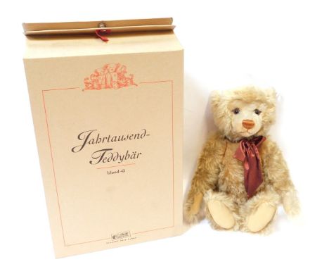 A Steiff blonde plush jointed Teddy bear, number 43, with labels and tag, boxed. 