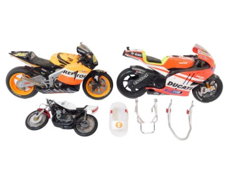 Three model motorbikes, comprising Ducati and Honda, and a Raleigh 3 bike. (3)