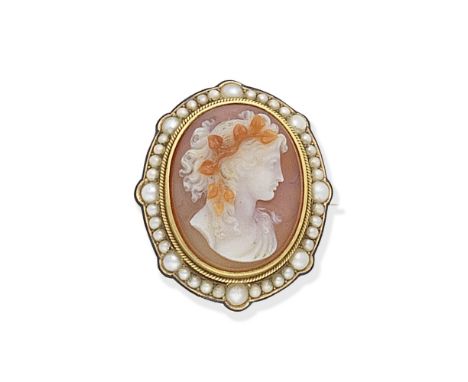 HARDSTONE CAMEO AND SEED PEARL BROOCH/PENDANT, CIRCA 1890Depicting a Bacchante, in a seed pearl surround, accented by half pe