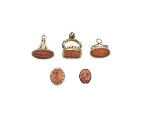 TWO FOB SEALS AND A SILVER-GILT FOB SEAL, 19TH CENTURYThe fob seals each with carnelian, comprising: a rectangular floral and