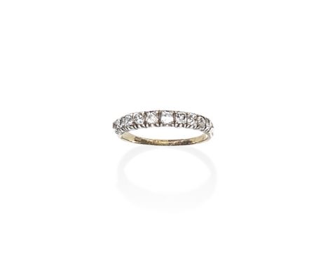 DIAMOND HALF ETERNITY RING, LATE 19TH - EARLY 20TH CENTURYSet with graduating cushion-shaped diamonds, mounted in silver and 