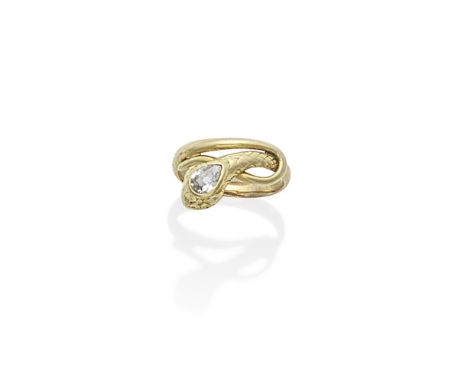 GOLD SERPENT RING, 19TH CENTURYDesigned as a coiled serpent with engraved scales, the head accented by a pear-shaped diamond,