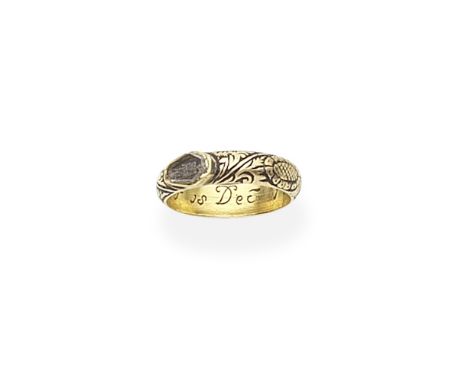 GOLD AND ENAMEL MEMORIAL RING, DATED 1718The coffin-shaped plaque set with hair overlaid with a skeleton within a rock crysta