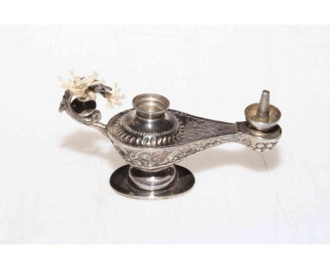 Miniature Aladdin's lamp cigar lighter.