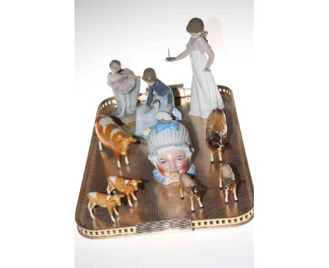 Beswick cows and calves, three Nao figures and baby storage jar.