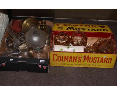 Collection of oil lamp parts, glass shades, brass chamber stick, etc.