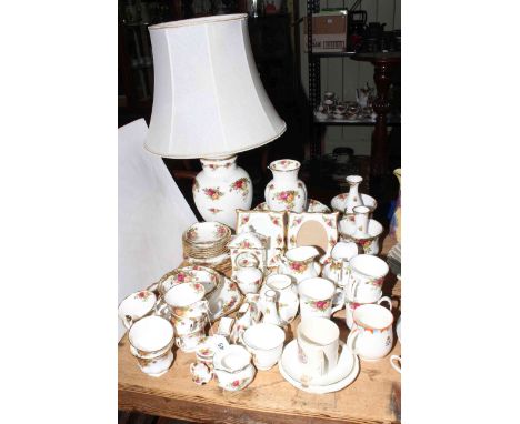 Collection of Royal Albert Country Roses china including table lamp and photograph frames, approximately forty pieces and com