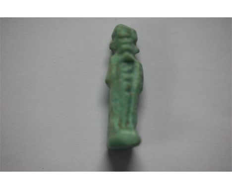Egyptian Ptah Amulet, Late Period, 664-332 BC A faience amulet of the god Ptah, with mummiform body and wearing a skull cap a